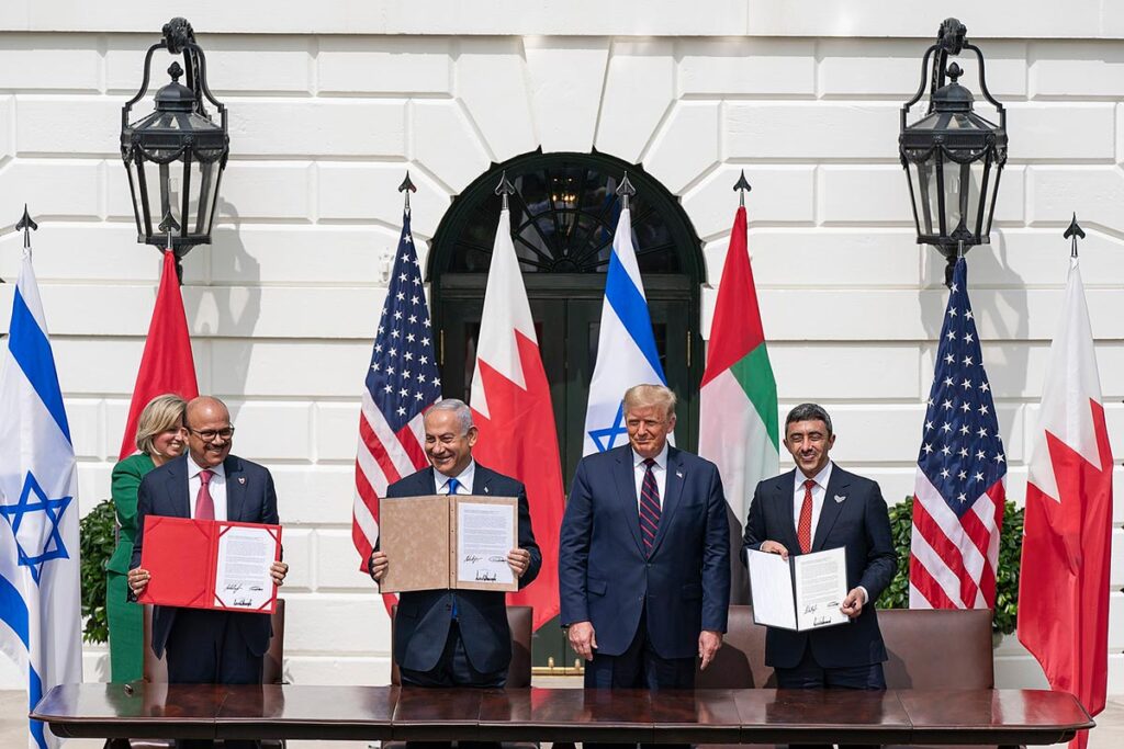 President Donald Trump, Minister of Foreign Affairs of Bahrain Abdullatif bin Rashid Al-Zayani, Israeli Prime Minister Benjamin Netanyahu and Minister of Foreign Affairs for the United Arab Emirates Abdullah bin Zayed Al Nahyan signs the Abraham Accords Tuesday, Sept. 15, 2020, on the South Lawn of the White House. (Official White House Photo by Shealah Craighead / Wikipedia Commons)