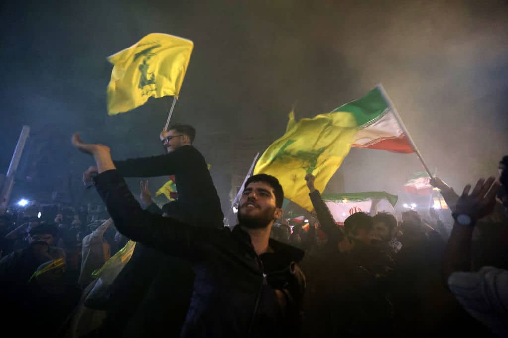 Demonstrators celebrate during a rally outside the British Embassy in Tehran on October 1, 2024, after Iran fired a barrage of missiles into Israel in response to the killing of Hezbollah leader Hassan Nasrallah and other Iranian-backed militias.