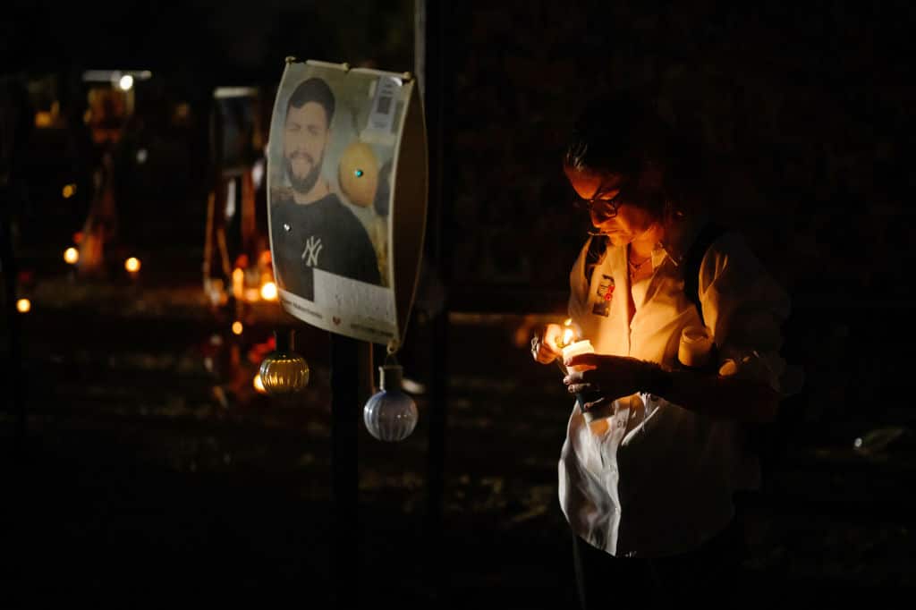 Family members and friends of the lost and kidnapped gather at the site of the Nova Festival to mark the one year anniversary of the attacks by Hamas, on October 07, 2024 in Re'im, Israel. Various commemorations are taking place around Israel to mark the  anniversary of the Hamas attacks in Israel. On October 7, 2023, members of Hamas mounted a series of attacks and raids on Israeli citizens in the Gaza Envelope border area of Israel. 251 Israelis and foreigners were kidnapped with nearly 100 still unaccounted for and 1139 people were killed. (Photo by Leon Neal/Getty Images)