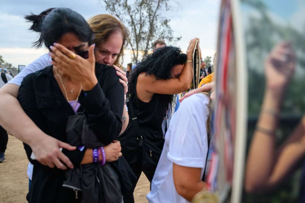 Family and friends gather at the Nova festival memorial to mark the first anniversary since Hamas attacked one year ago on October 07, 2024 in Re'im, Israel. (Photo by Alexi J. Rosenfeld/Getty Images)