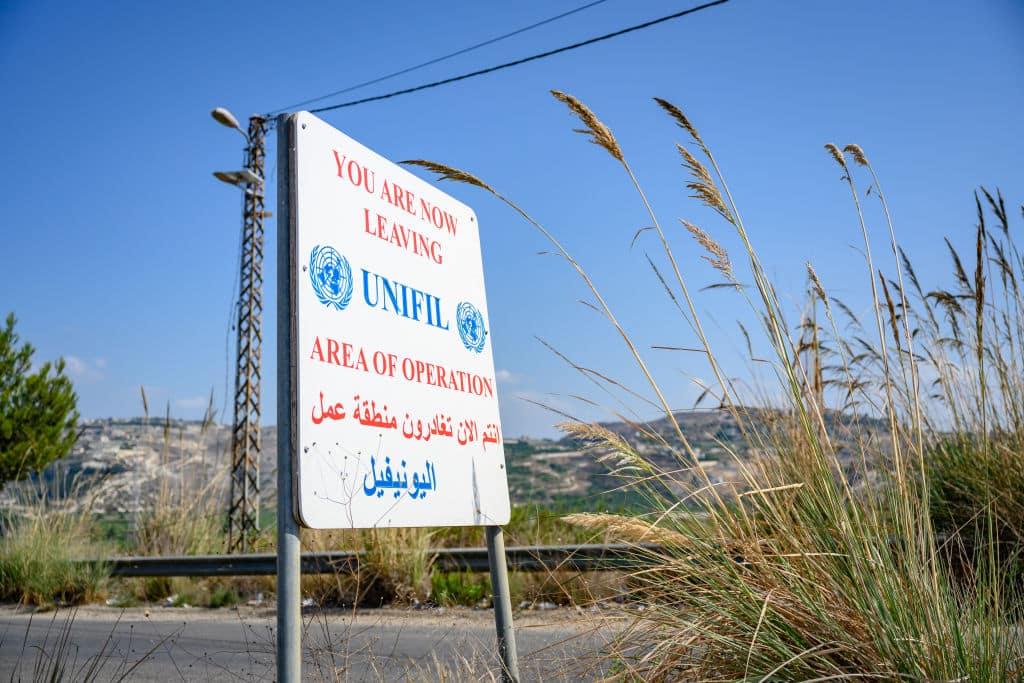 TYRE, LEBANON - OCTOBER 15: A sign marks the northern operational boundary of United Nations Peacekeepers of the UNIFIL force, which has seen multiple injured soldiers due to cross-border Israeli military action against its posts along the Blue Line that separates Lebanon and Israel, on October 15, 2024 north of Tyre, Lebanon. Israel has demanded that UN peacekeepers withdraw from southern Lebanon, claiming that the Iran-backed Shiite Hezbollah militia - which Israel has vowed to dismantle with airstrikes and a ground incursion - is using UN posts as protective cover, a claim the UN denies. (Photo by Scott Peterson/Getty Images)