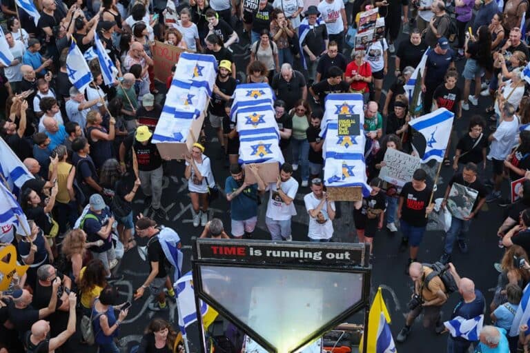 Protesters carry symbolic coffins during an anti-government rally calling for the release of Israelis held hostage by Hamas in Gaza since October, in Tel Aviv on September 1, 2024.