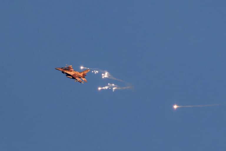 This photo taken from a position in northern Israel shows an Israeli Air Force fighter jet firing flares as it flies to intercept a hostile aircraft that launched from Lebanon over the border area with south Lebanon on August 25, 2024.