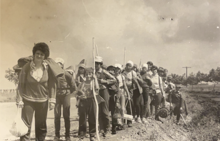 Ronnie Volman's father (holding a stick towards the front) with his class, 1984. Teachers would take their classes on outings in the countryside (Photo courtesy of the author).