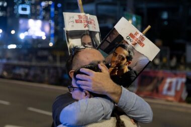 Protesters calling for the return of hostages held in the Gaza Strip react after a Gaza ceasefire and hostage release deal was reached on January 15, 2025 in Tel Aviv, Israel.